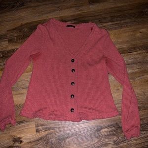 Button ruffle sweater.